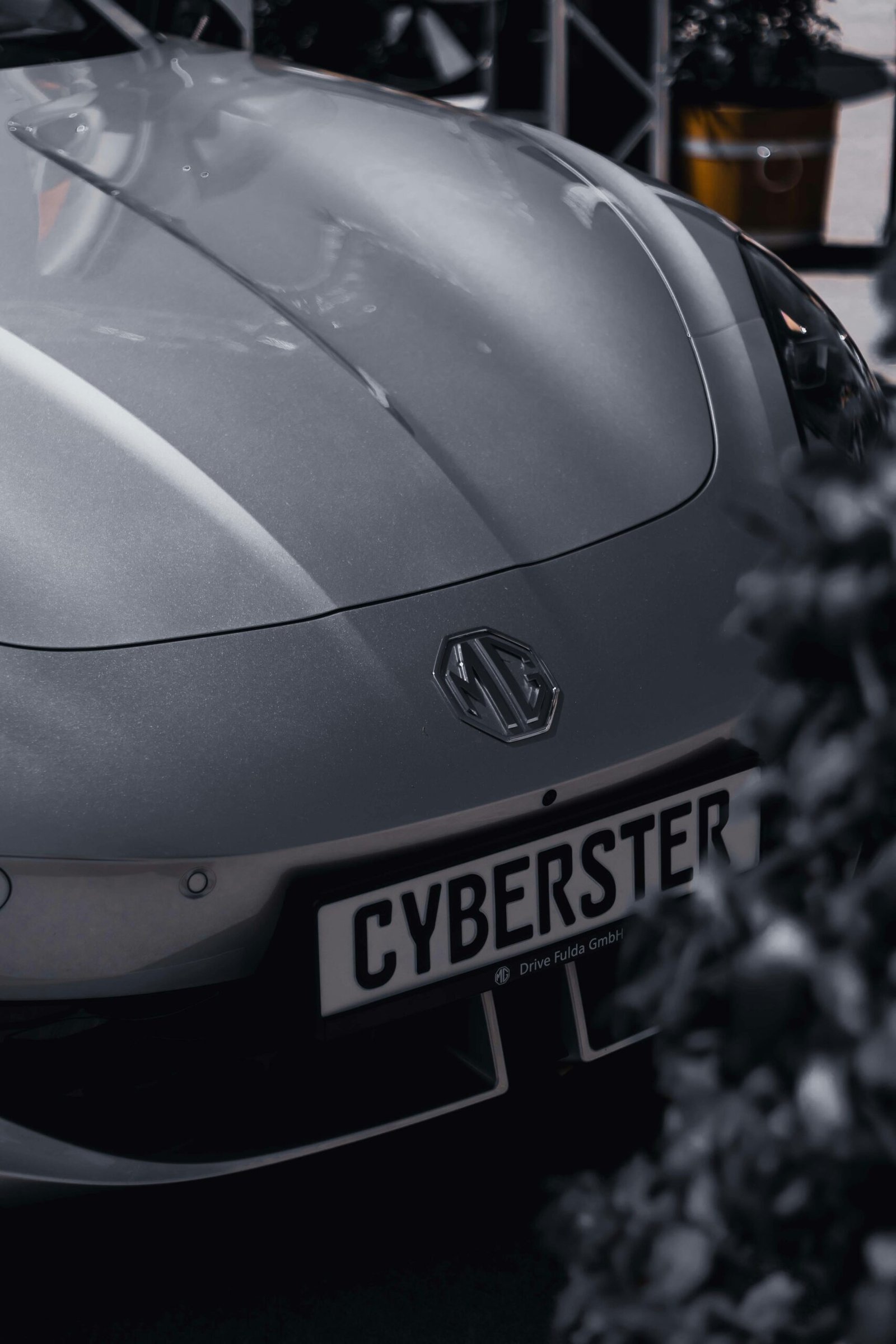 pexels-photo-31885505-31885505 Close-up of a metallic MG Cyberster car parked in Fulda, Germany.